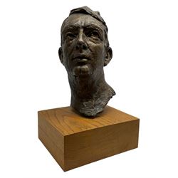 Bronze portrait bust of a man, the hollow cast figure raised upon square wood plinth and signed to reverse G. Abouaf, H46cm