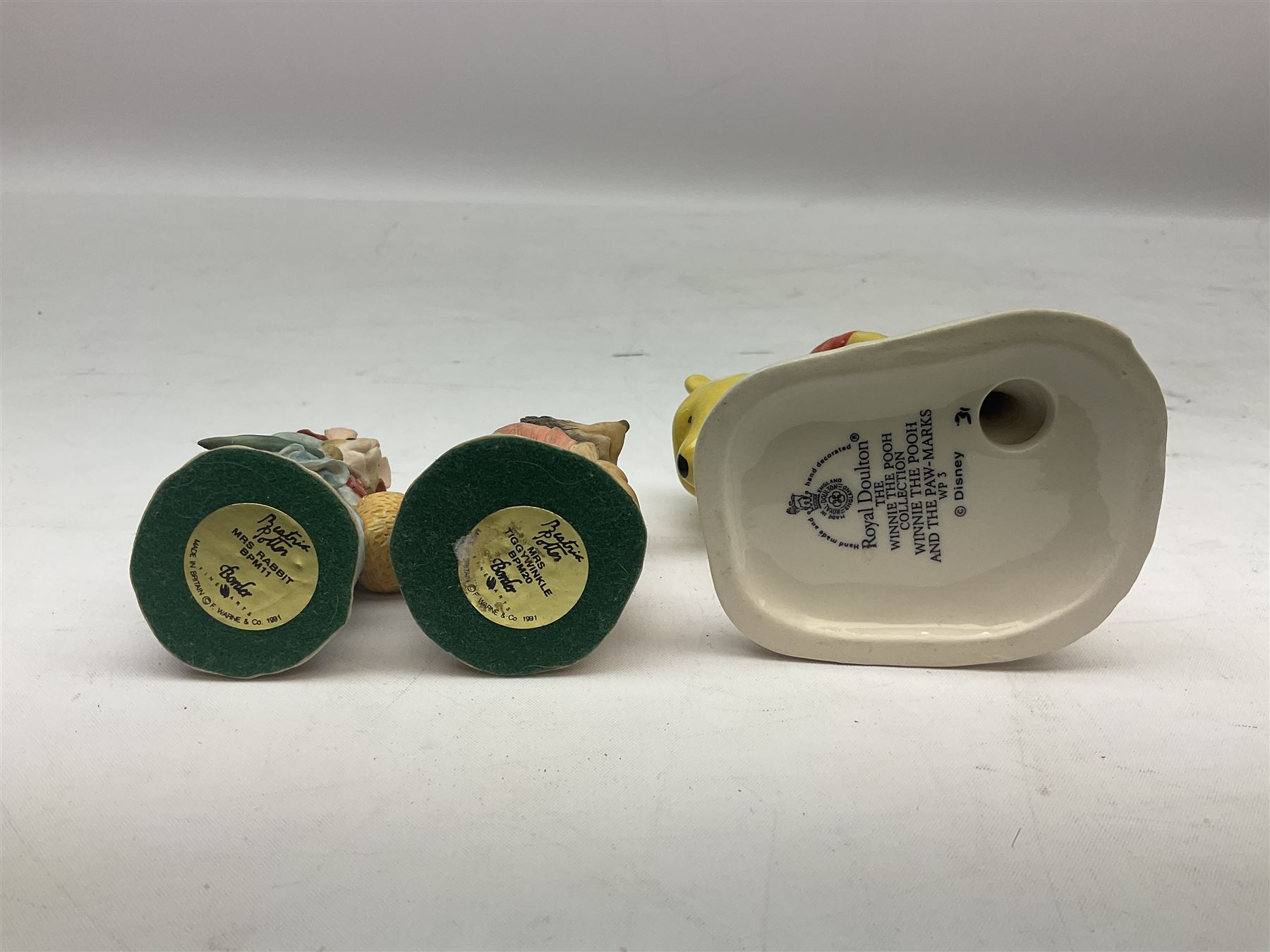 Two Royal Doulton Brambly Hedge figures comprising ‘Mrs Saltapple’ and ‘Poppy Eyebright’, Royal Albert Beatrix Potter ‘Foxy Whiskered Gentleman’ and ‘Mr Benjamin Bunny’, all with boxes, two Border Fine Arts Beatrix Potter figures comprising ‘Mrs Tiggywingle’ and ‘Mrs Rabbit’, Royal Doulton ‘Spike and Tyke’ and ‘Winnie Pooh and Footprints’ both with boxes, all marked beneath