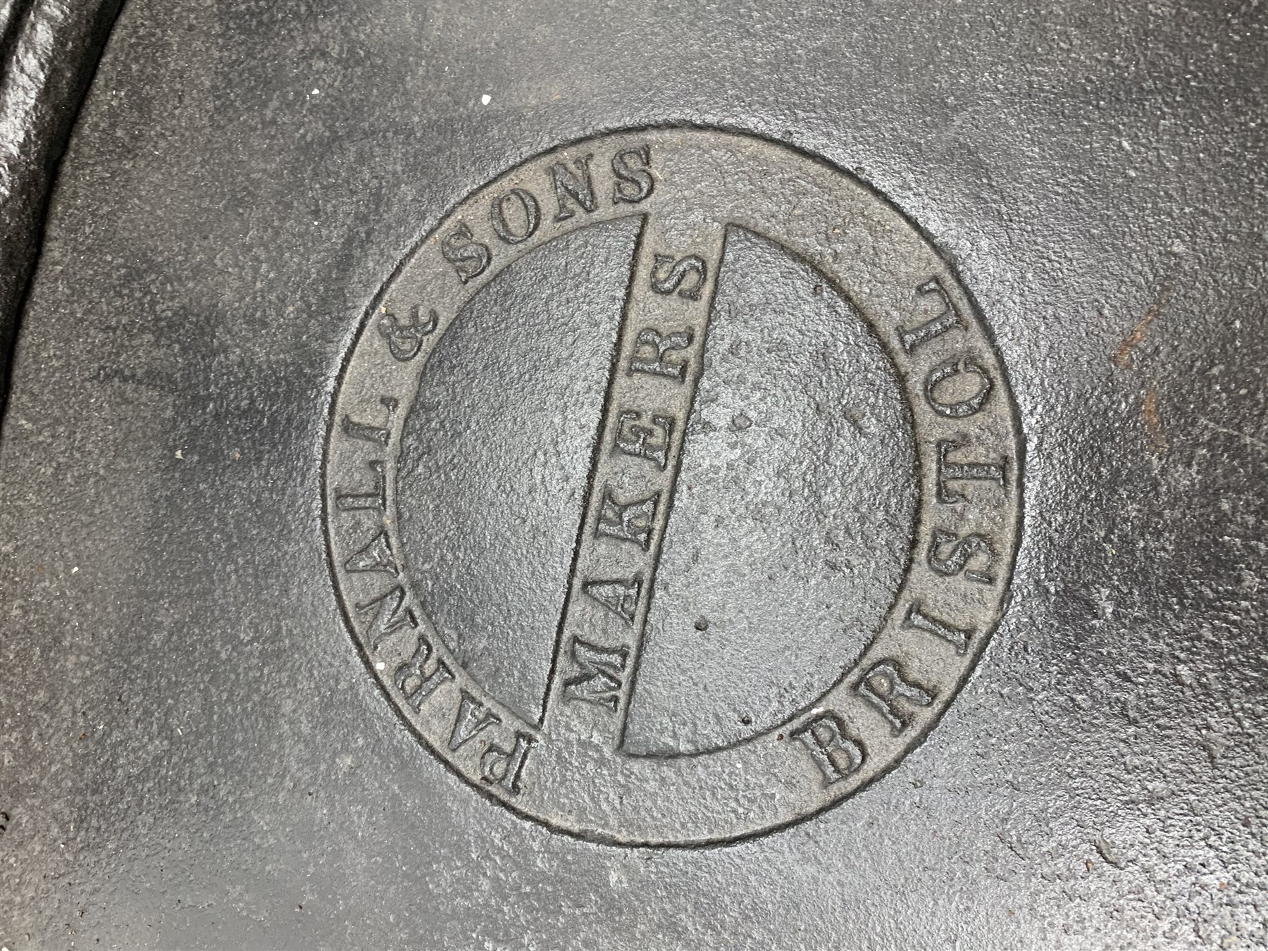 19th century platform scales by Parnall & Sons. Bristol, black painted cast iron, raised back decorated with foliage scrolls and fruit garland, H128cm