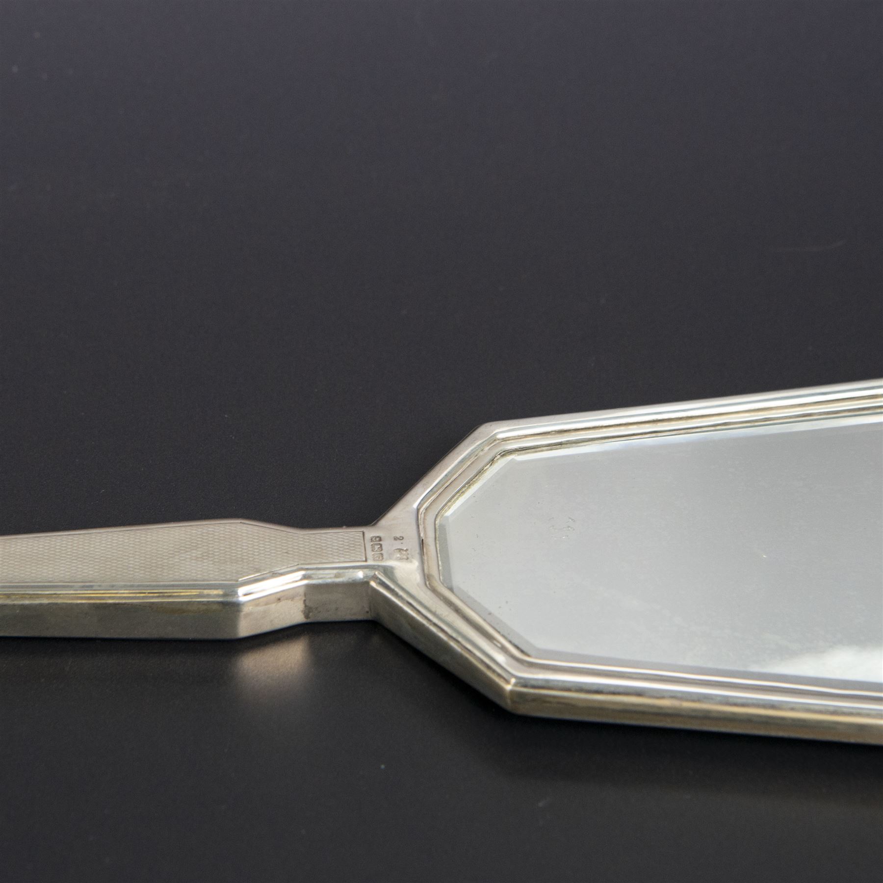 1930s silver mounted three piece dressing table set, comprising hand mirror, hair brush and clothes brush, hallmarked Barker Brothers Silver Ltd, Birmingham 1931