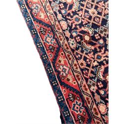 North West Persian Mahal indigo ground runner rug, the field decorated with all-over crimson Herati motifs, the guarded border with trailing geometric designs