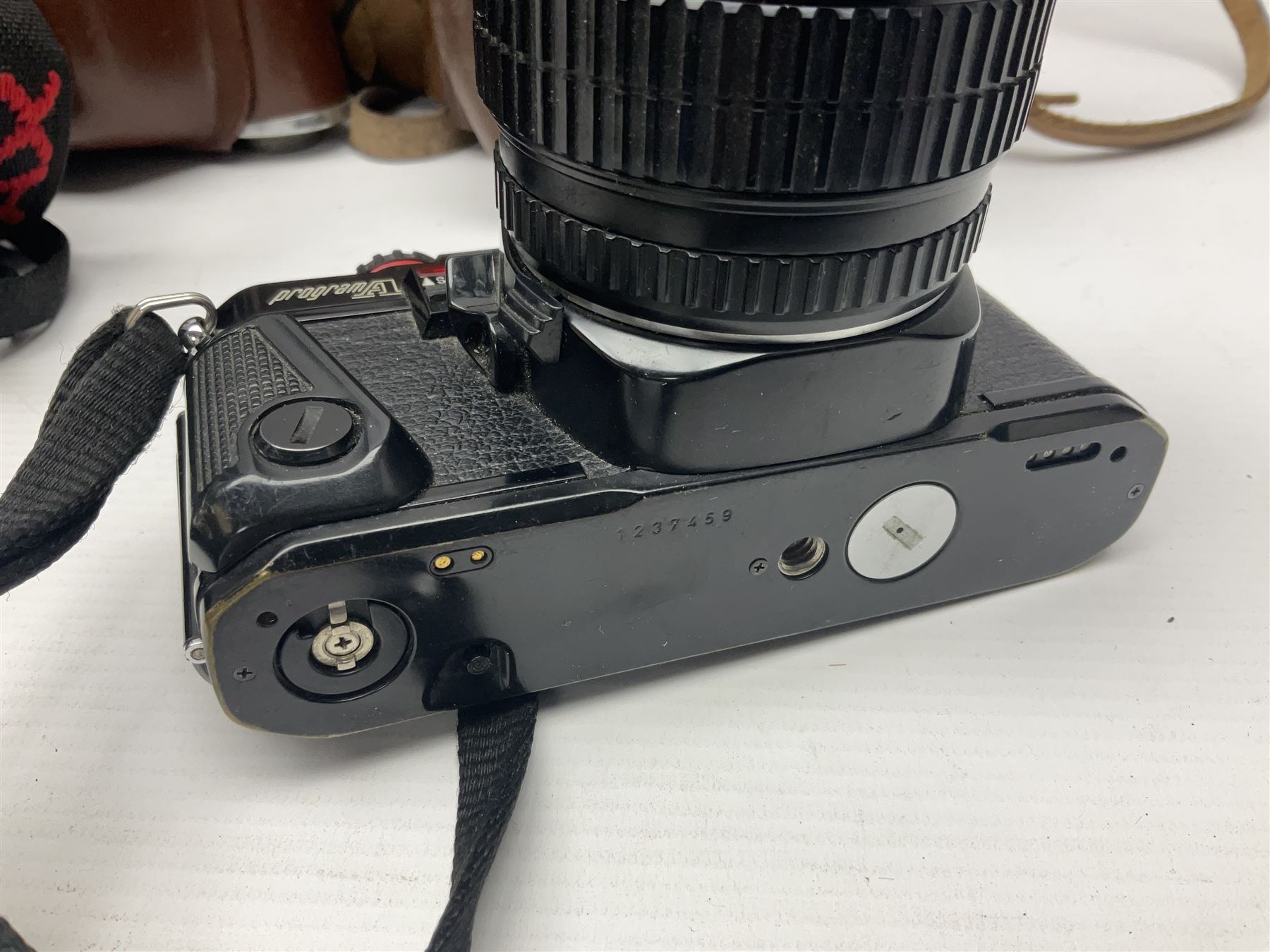 Collection of cameras and lenses, to include Pentax Program A camera body, serial no 123759, with 'Pentax-A zoom 1:3.5-4.5 28-80mm' len, Praktica EE2 camera body with 'Pentacon electric 1.8/50' lens etc, together with a Manfrotto tripod 