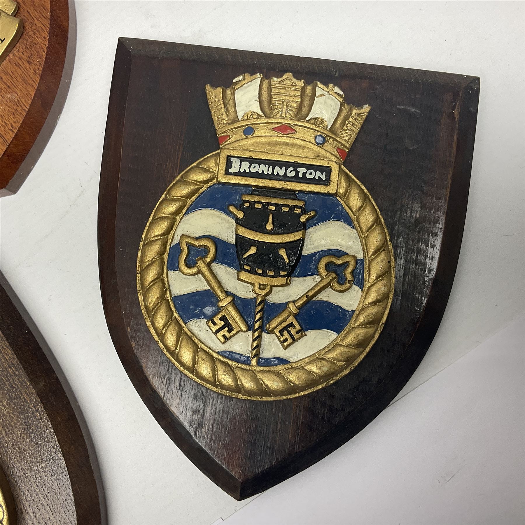 Six Naval wall shields, including HMS President, Vanguard, HMS Kilmorey etc, and another plaque 