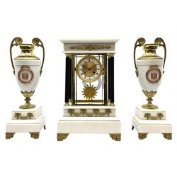 Late 19th century French Empire style clock, with white marble garniture de cheminee, white enamel Roman chapter ring with engine turned centre plate and ornate slip, the dial and movement in bevelled glass and brass casing, four reeded column supports, applied cast gilt metal swags, on flower head cast bracket feet, twin train driven movement striking on coil, the pendulum decorated with Greek mask surrounded by grapes and leafage, pair white marble urn garnitures with gilt metal handles and foot on stepped square base