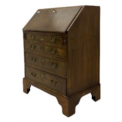 Georgian walnut bureau, banded and feather strung, fall front enclosing fitted interior, four graduating drawers, on bracket feet