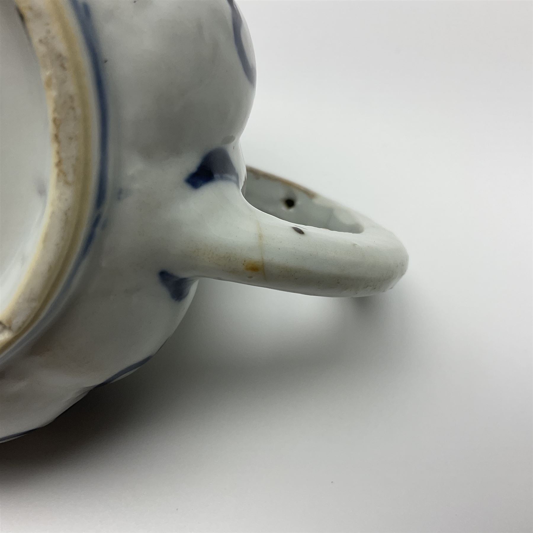 18th century Chinese blue and white teapot, painted with floral sprays, with lobed body and cover, H11cm