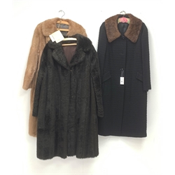 A Ladies light brown Musquash fur coat, together with a faux fur example, and another coat with fur collar. 