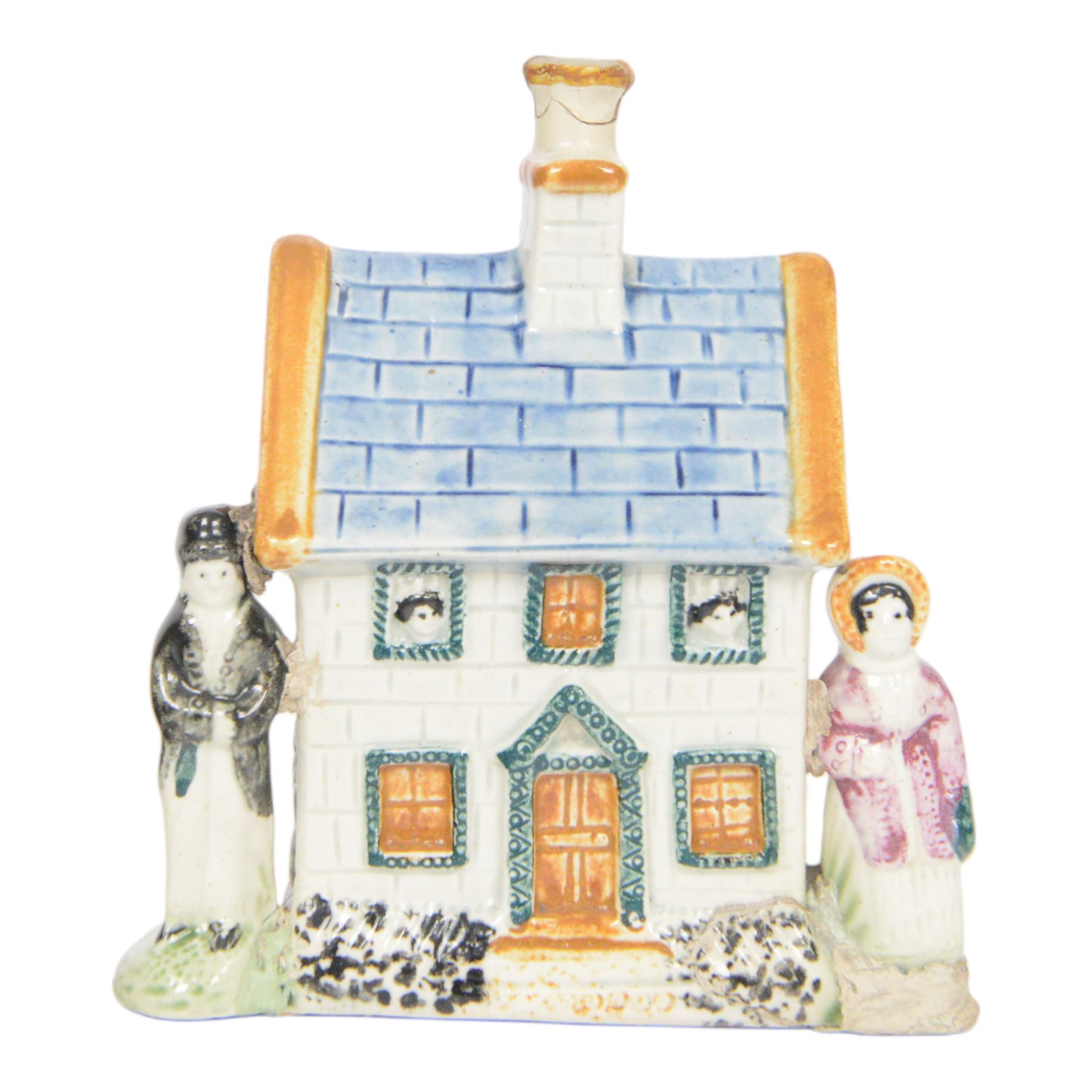 19th Century Staffordshire pearlware Prattware type money box, modelled as a houe with two figures to the front corners, H13cm