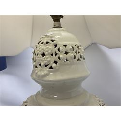 Modern pierced oriental white ceramic vase shaped table lamp, together with a blue and white baluster shaped example decorated with figures upon elephants, both with shades, tallest H83cm incl shade