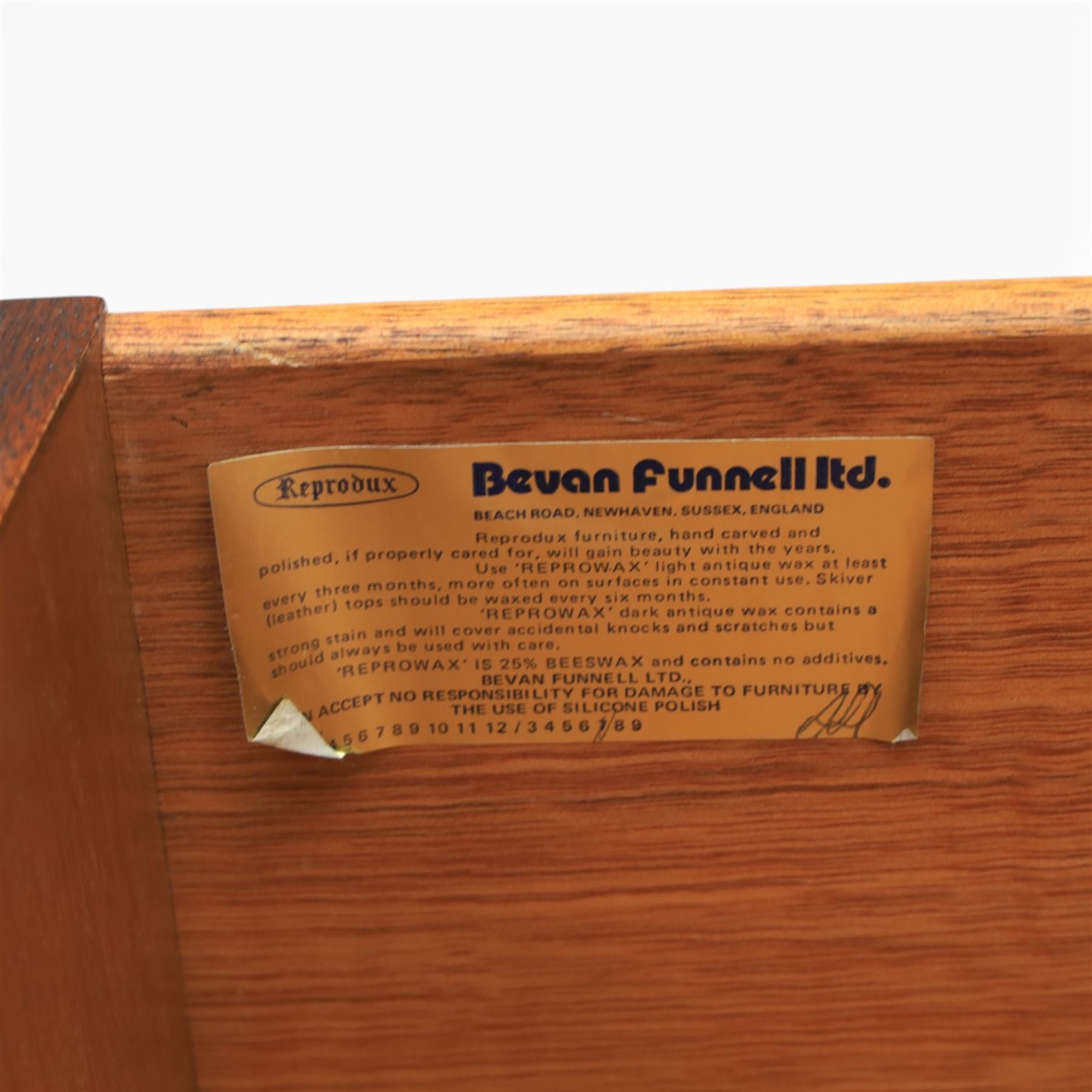 Reprodux - Georgian design pair of mahogany bow-front cabinets, moulded lifting hinged top, above a locking cabinet with drawer below, raised on bracket feet 