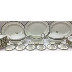 Wedgwood tea and dinner wares decorated in the Black Ulander pattern, comprising nineteen dinner plates, eighteen salad plates, eighteen side plates, twenty four bowls, two tureen and covers, sauce boat and stand, three oval platters, and six coffee cans and six saucers. 