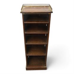 Victorian rosewood bookcase, pierced brass three quarter gallery, with four graduating shelves, raised on a plinth base 