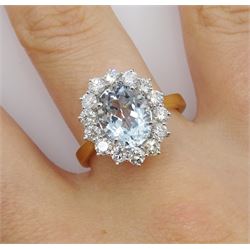 18ct gold oval aquamarine and round brilliant cut diamond cluster ring, hallmarked, aquamarine approx 2.50 carat, total diamond weight approx 0.90 carat