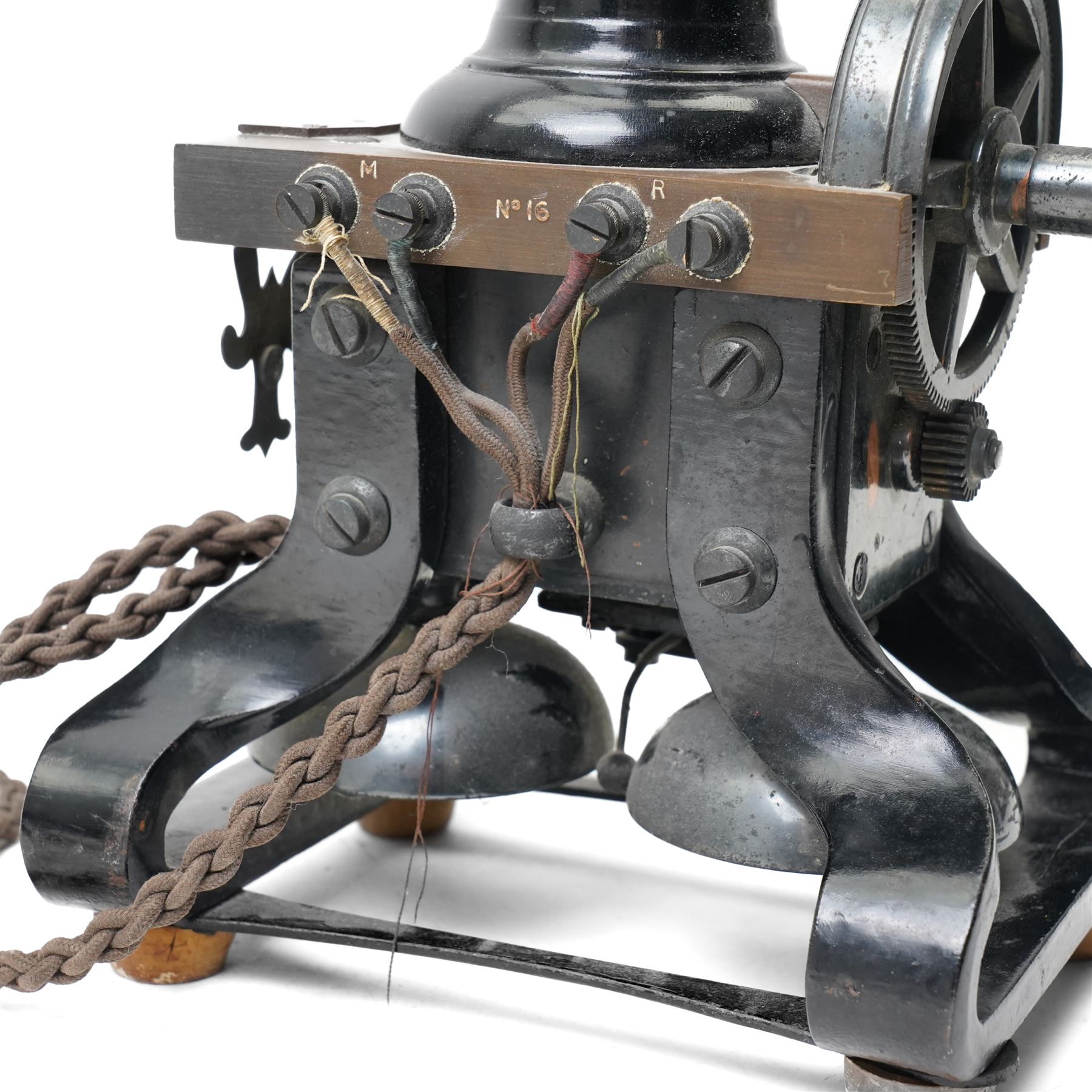 Early 20th century L M Ericsson & Co Skeletal table telephone, the earpiece impressed No.28, with black painted frame and possibly original wires, H29cm