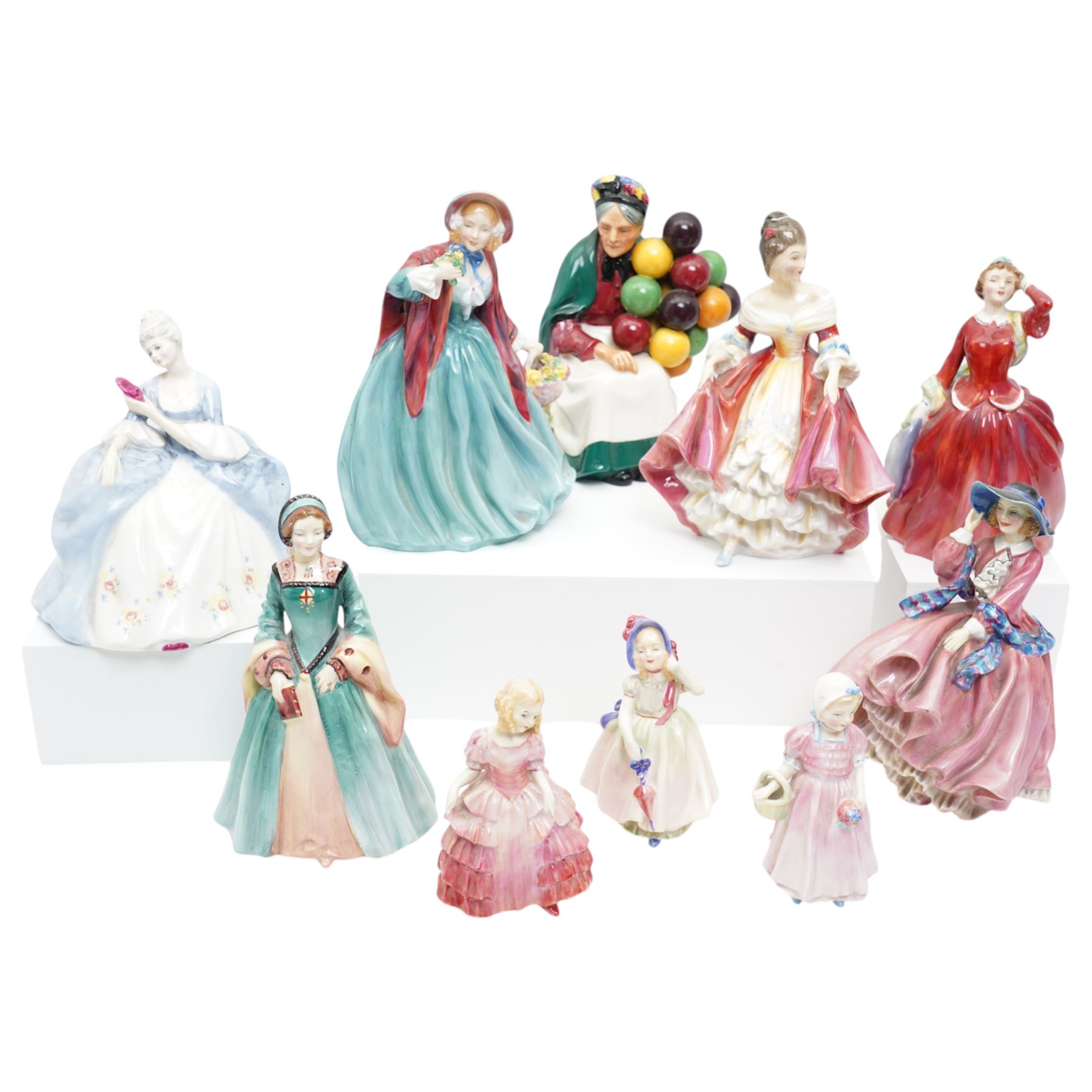 Collection of ten Royal Doulton figures, comprising 'Lady Charmian' HN1948, 'Rose' HN1368, 'Tinkle Bell' HN1677, 'Babie' HN1679, 'Southern Bell' HN2229, 'Wistful' HN2472, 'Janice' HN2022, 'Top O' The Hill' HN1849, 'The Old Balloon Seller' HN1315, and 'Blithe Morning' HN2065 (10)
