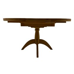 Solid light oak circular extending dining table, with leaf, on pedestal base