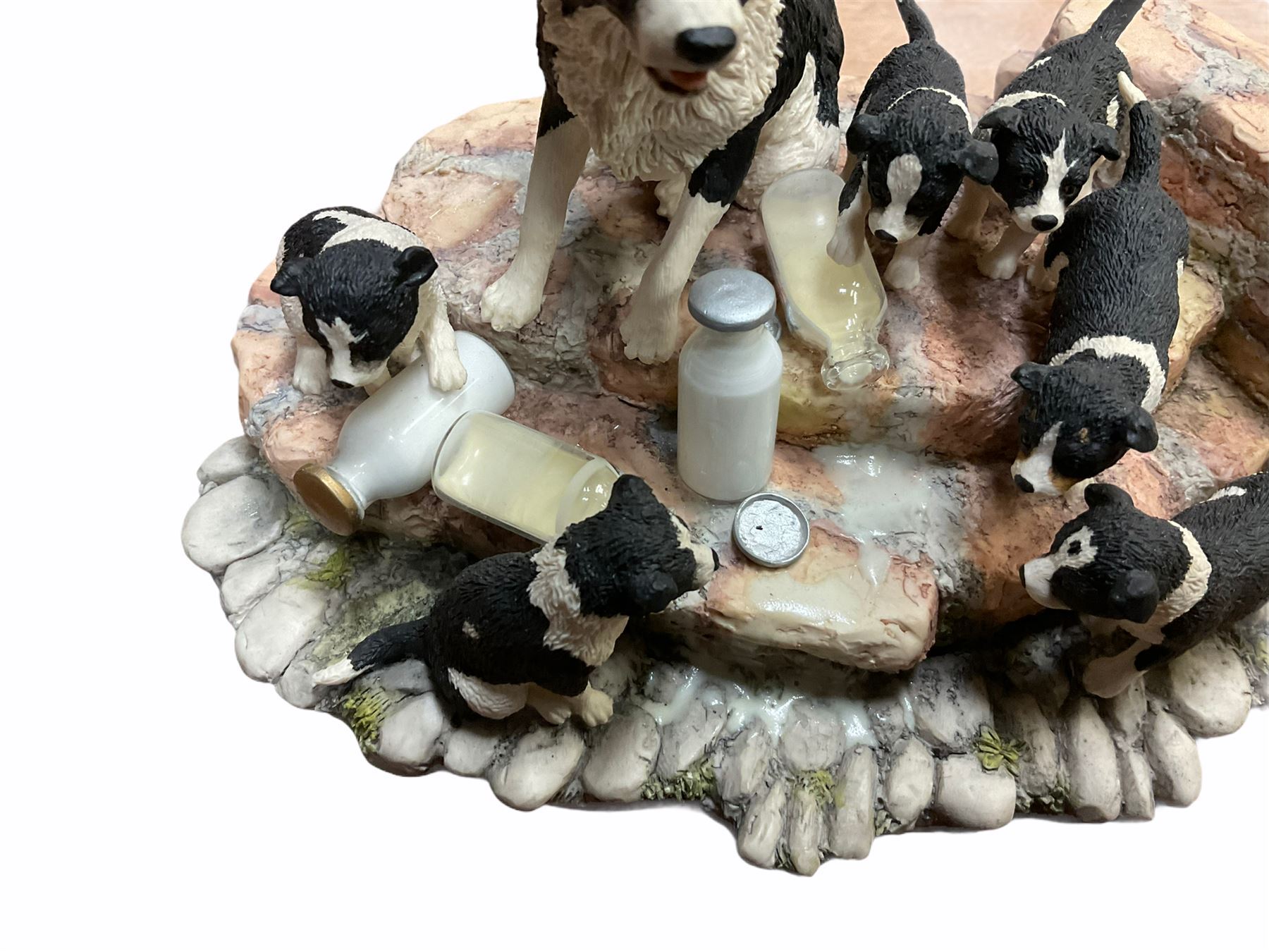 Border fine arts figure, Border collie, model no MT07, by M Turner H22cm, along with Border fine arts figure Spilt milk, model number JH99, by Ray Ayres H15cm.