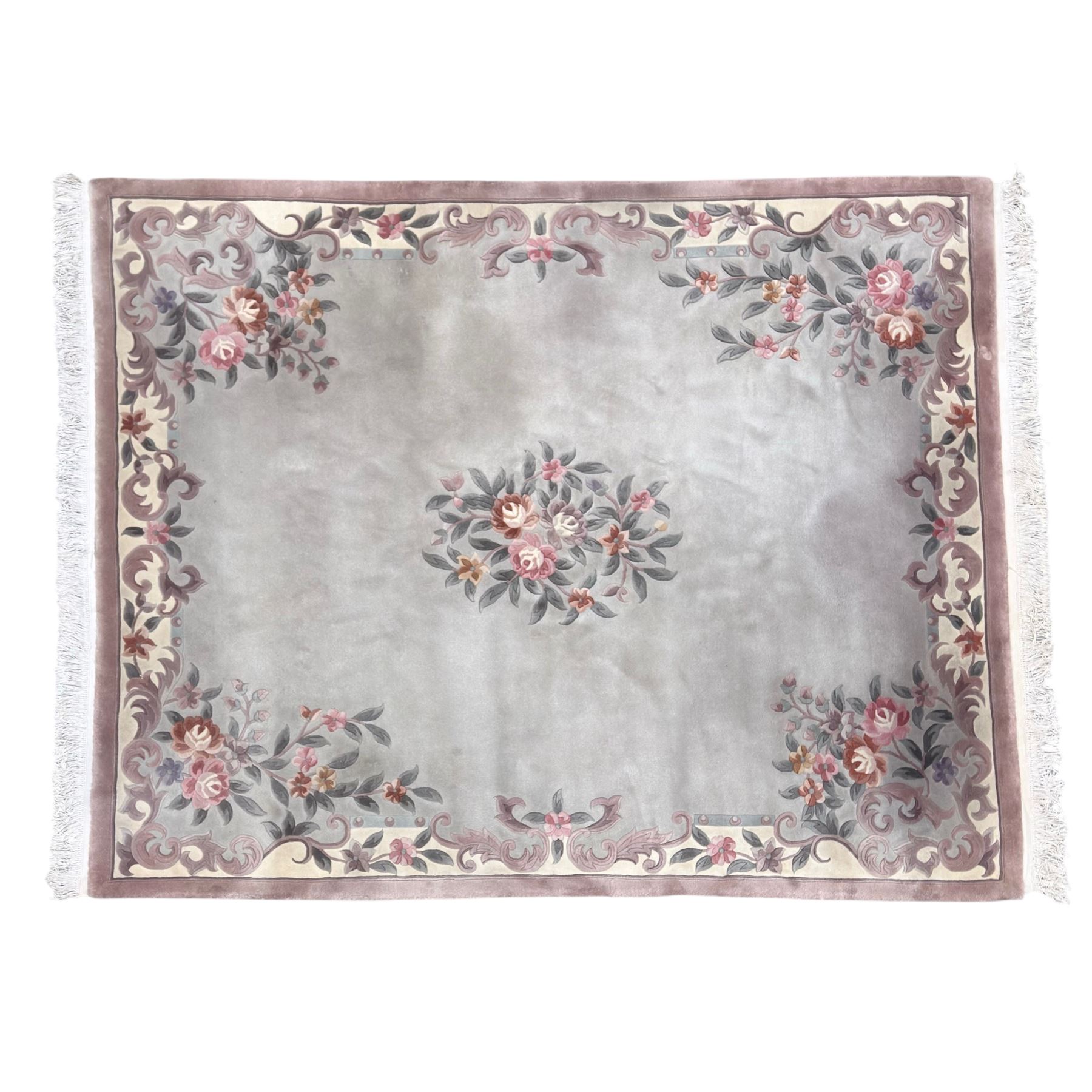 Chinese Aubusson-style jade green wool rug, with a floral medallion and floral corner sprays with a scrolling acanthus and ribbon border in tones of teal, cream, pink, mauve, and cotton fringe ends