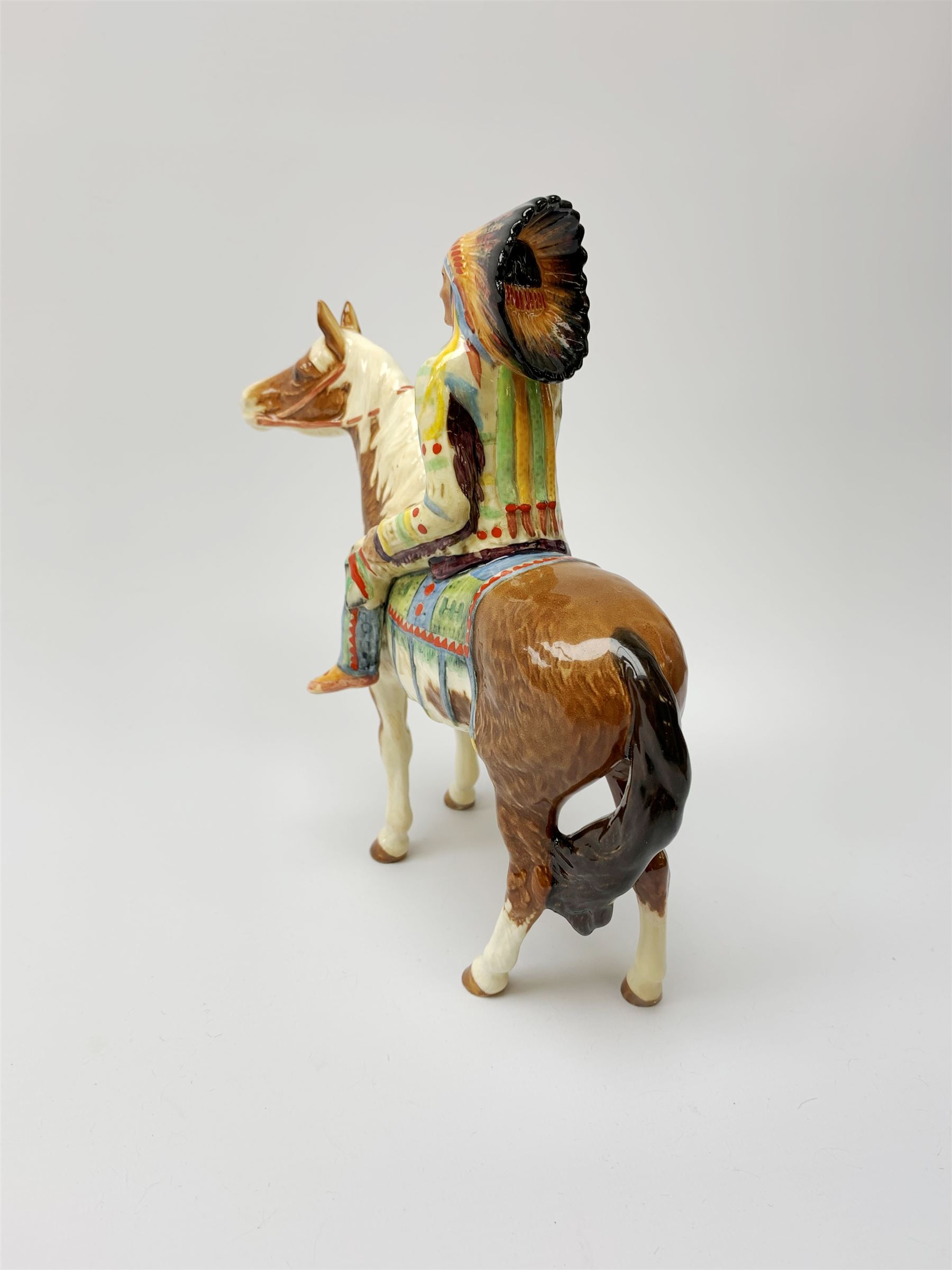 A Beswick Native American on horseback, with printed mark beneath, H21.5cm. 