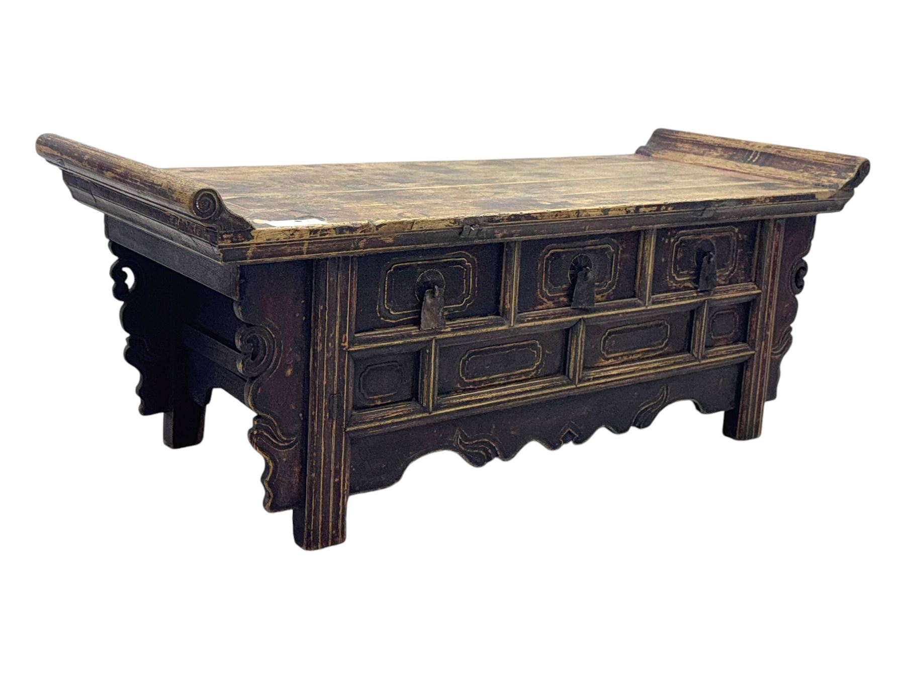 Mid-19th century elm low altar table, rectangular top with scrolled ends, fitted with three small drawers, pierced and scroll carved brackets, on square moulded supports 