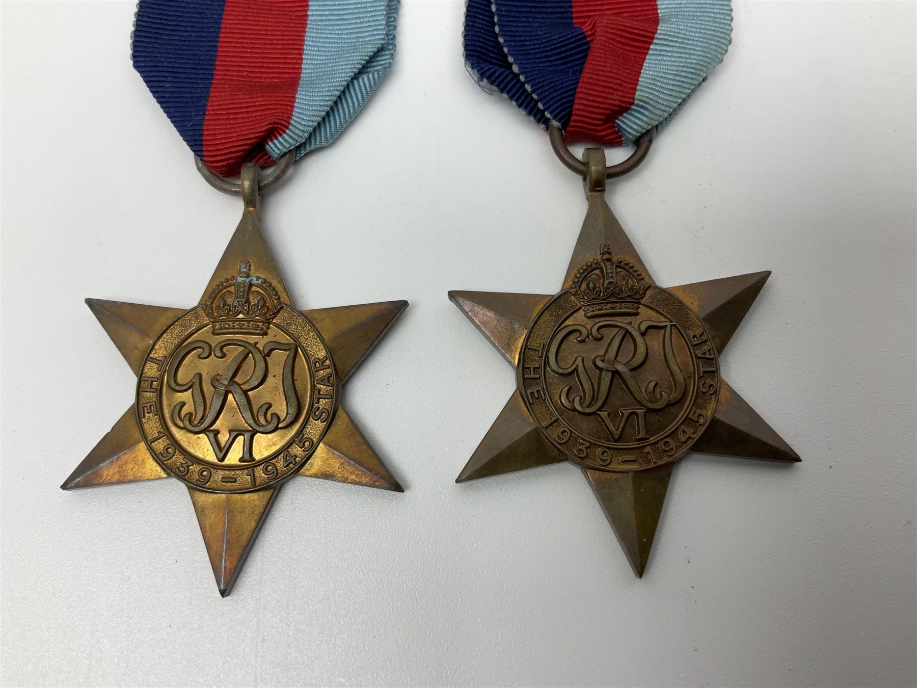 Eleven WW2 medals comprising three 1939-1945 war medals, two Defence medals, three 1939-1945 Stars, Atlantic Star, Africa Star and Italy Star; miniature QEII Naval LS & GC medal; all with ribbons; and WW2 postumous medal slip to Flight Sergeant L.N. Clark