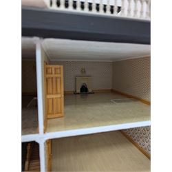 1:24 scale four-storey tudor-style dolls house, with black and white exterior, balcony garden, glazed panelled windows and wooden shingle roof, with decorated interior and wired fireplaces and lighting, H65cm, W58cm, D31cm, 