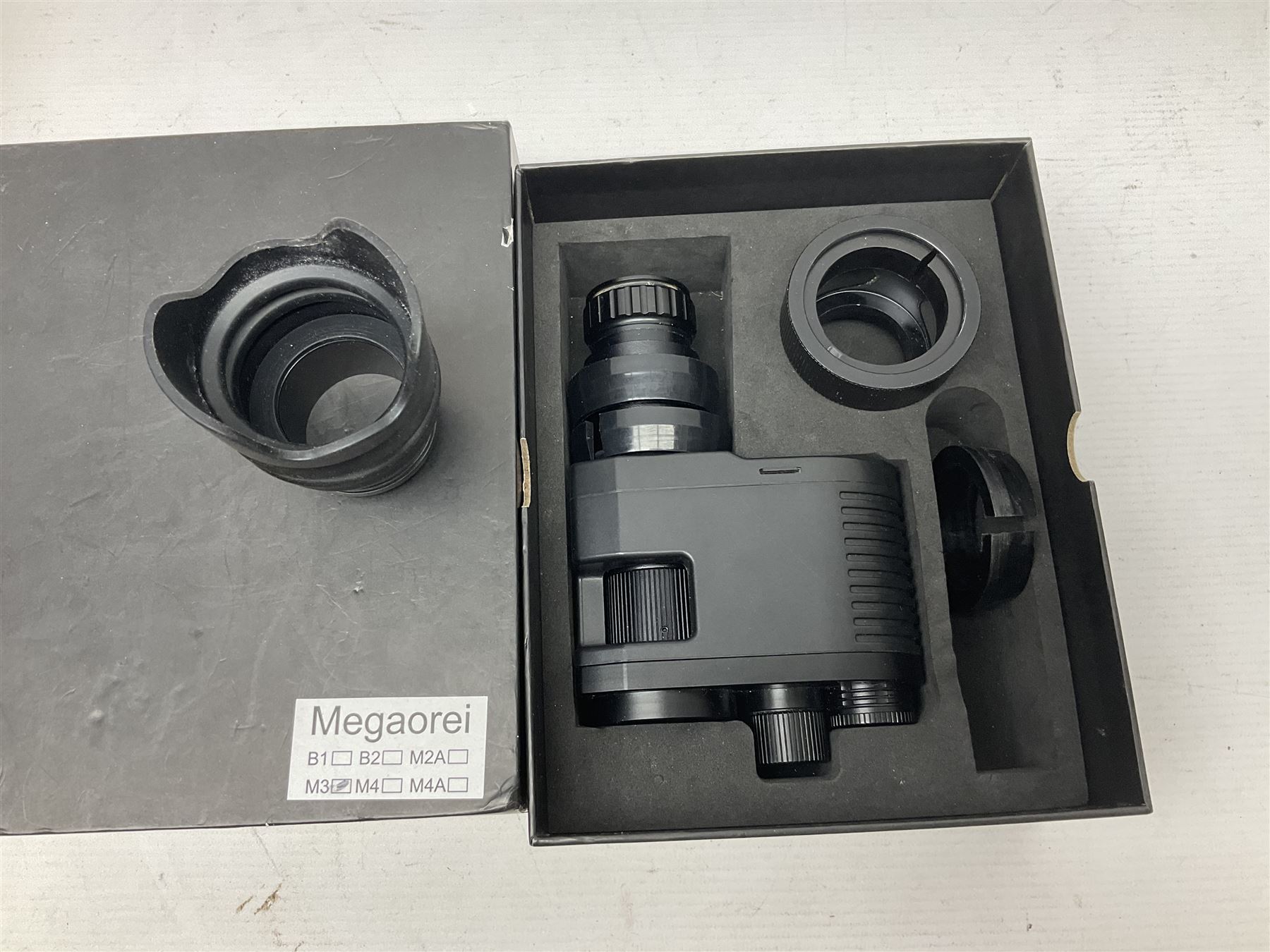 Four shooting accessories - Riflescope 3-9 x 50 scope; Digital Trail Camera; Megaorei M3 night sight add on; and Logan Gun Lamp; all boxed (4)