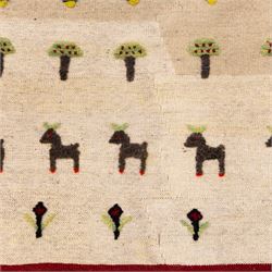 South West Persian Qashqai pictorial flatweave kilim, ivory field decorated with rows of stylized animals, bird and tree motifs applied in raised wool pile against a flat-woven ground, arranged in horizontal bands beneath a simple geometric panel enclosed by a broad red ground border with polychromed geometric devices 