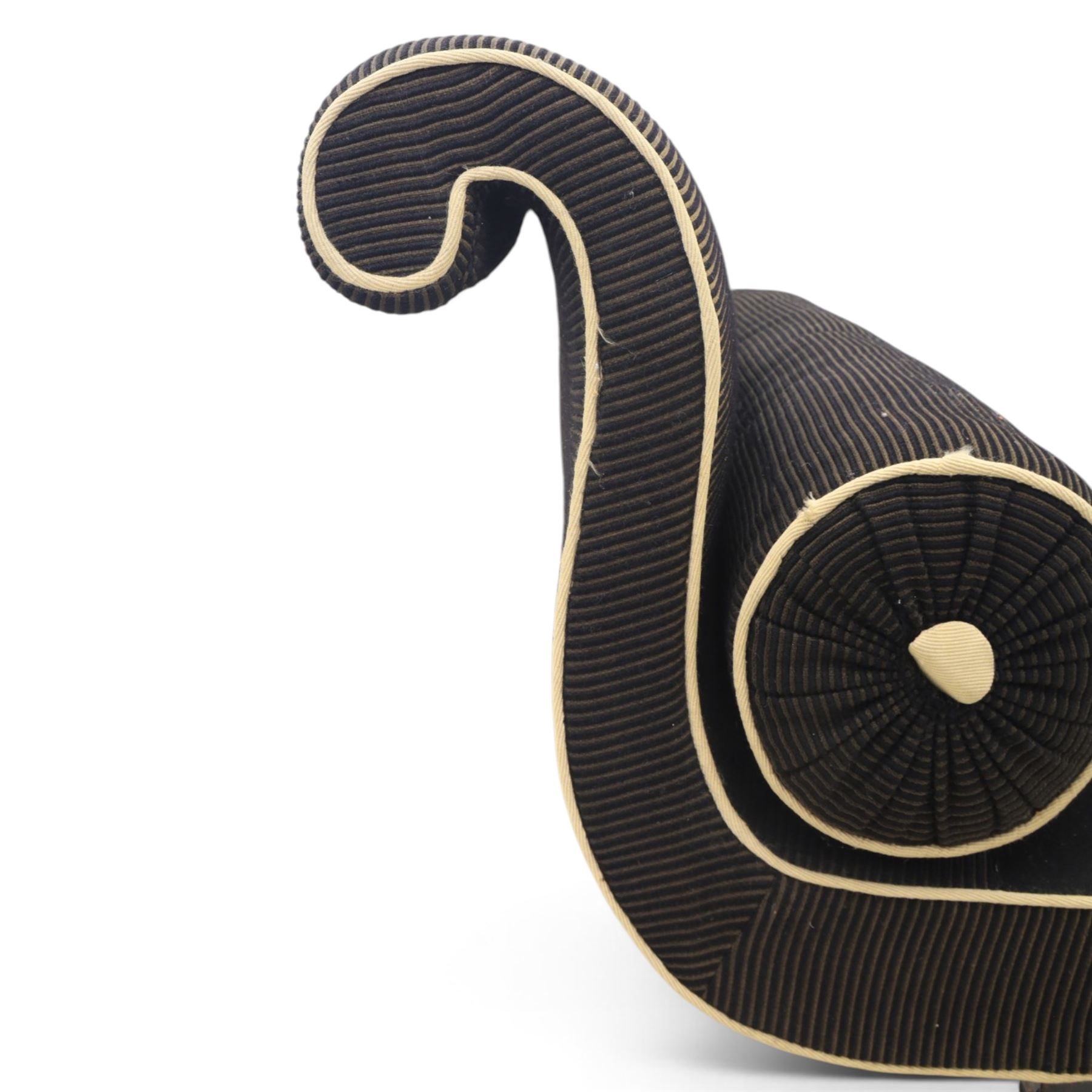 Victorian ebonised chaise longue, upholstered in black fabric with scroll headrest and bolster cushion, rectangular seat with rounded corners, raised on turned supports terminating in brass and ceramic castors