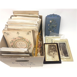  Collection of over one hundred Victorian chromolithograph and other photograph album leaves and title pages, each with single or multiple apertures, together with three photographs on glass, easel style photo album and book on Photographic Lenses etc  