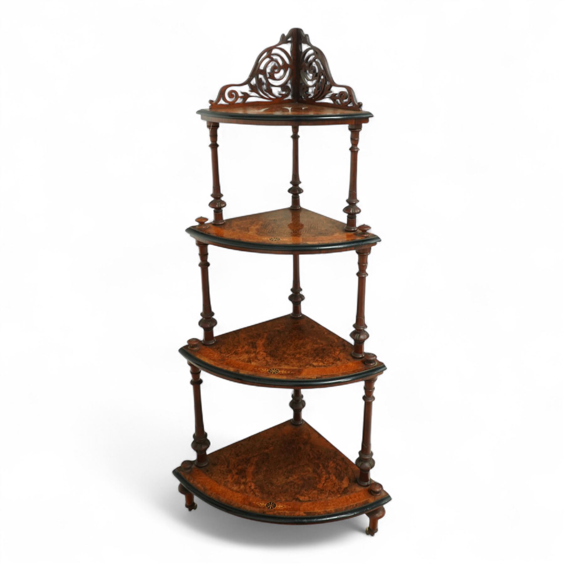 Late Victorian inlaid corner etagere with four tiers in figured walnut, top tier with pierced fretwork gallery above turned upright supports