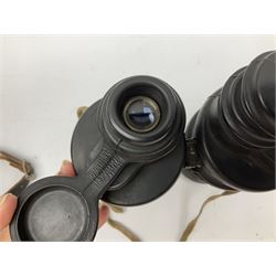 Pair of WWII German U-boat binoculars probably 7 x 50 by Leitz, with rubber eye piece protector covers and leather case stamped with Kriegsmarine mark to the lid and dated 1944, with leather strap.