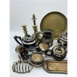 A quantity of assorted silver plate, comprising largely silver plate, to include tea wares, candlesticks, cased flatware, pair of chambersticks, pierced swing handled dish, toast rack, tankards, etc. 