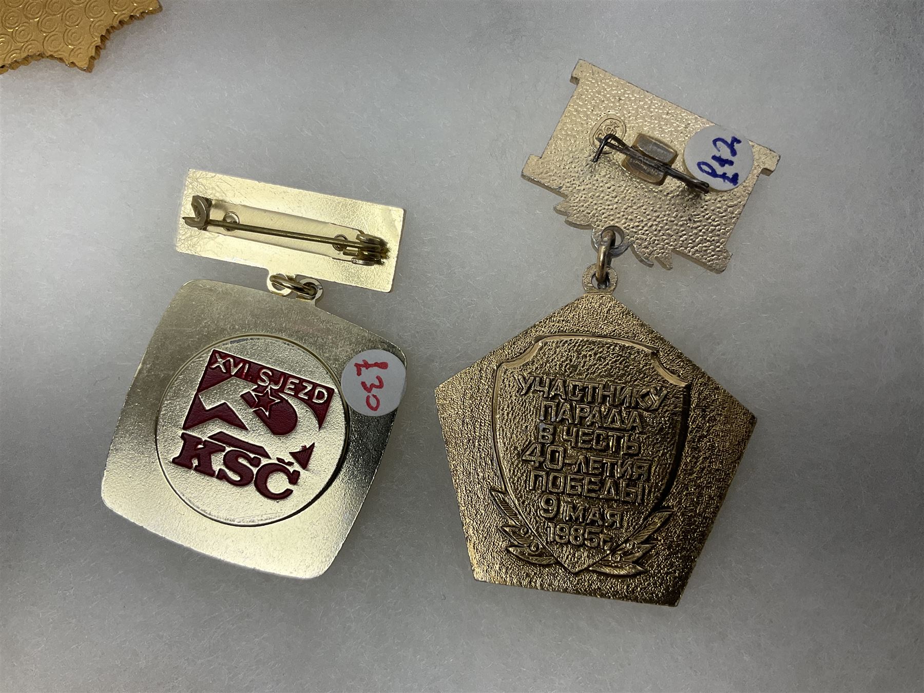 Nineteen Russian Soviet Tank Commemoration badges and medals, in small display case