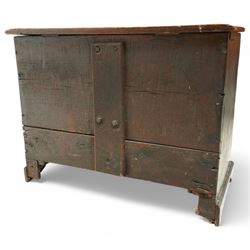 18th century and later oak coffer bach, moulded hinged lid over panelled front and single drawer, shaped and stepped arch panels, on bracket feet, in black paint finish
