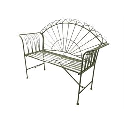 Wrought metal garden bench, painted in distressed teal 
