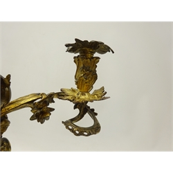  Pair of late 19th century Rococo Revival bronze two branch Candelabra, urn shaped sconces on floral scroll branches, eagle and scroll column and shaped circular base, H36cm, W37cm (2)  