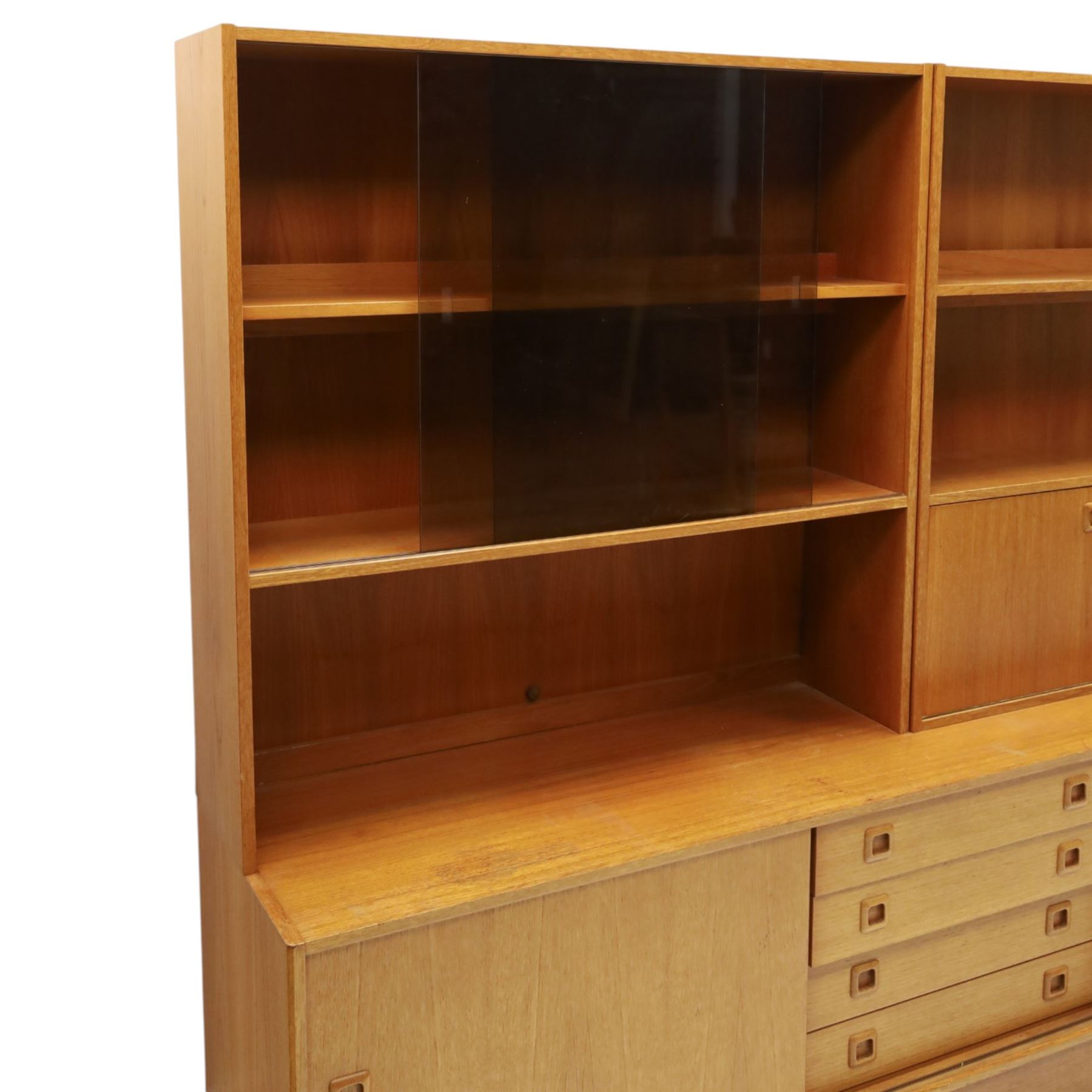 Clausen & Son Silkeborg - Danish 1960s teak highboard wall unit, the upper modular section with open shelves, smoked glass sliding doors and 12