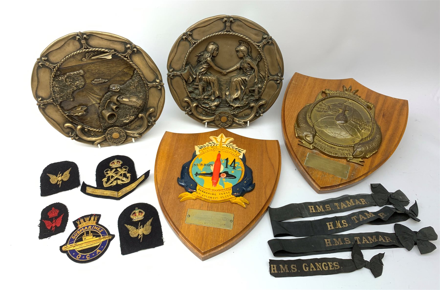  Two Submarine Force US Atlantic Fleet presentation plaques, the first detailed Subron 14, the second USS Abraham Lincoln 602, each H32.5cm, together with five uniform patches, four cap tallies, detailed HSM Tamar (x3), and HMS Ganges, and a set of two limited edition Euro Tunnel commemorative presentation plaques, The Breakthrough 1st December 1990 and Celebration 6th May 1994, D27cm, complete with original certificates.  