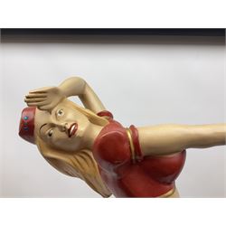 Composite Superman with cape, together with a composite female statue holding the American flag, tallest example H103cm