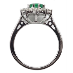  18ct white gold oval emerald and diamond cluster ring, stamped 750, emerald 1.20 carat, diamond total weight approx 1.00 carat  