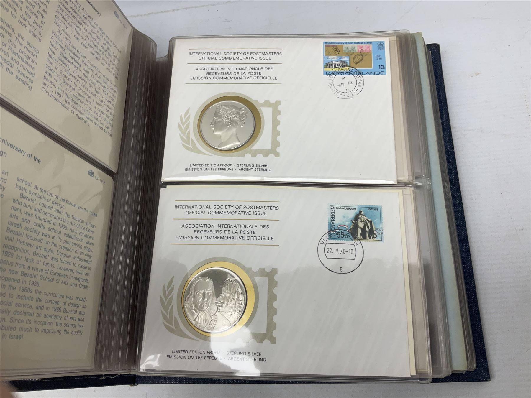 Thirty-six 'International Society of Postmasters Official Commemorative Issues' sterling silver proof medallic covers dating from 1975 to1977, housed in the official folder