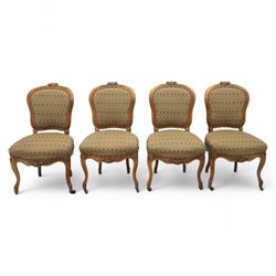 Set of four Victorian walnut framed salon chairs, upholstered in olive fabric with diamond...