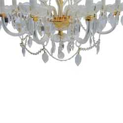 Late 20th century gilt brass and glass twelve branch chandelier, with glass swags and drops