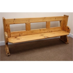  Stripped and waxed pine pew, solid end supports with arched sledge feet, W185cm  