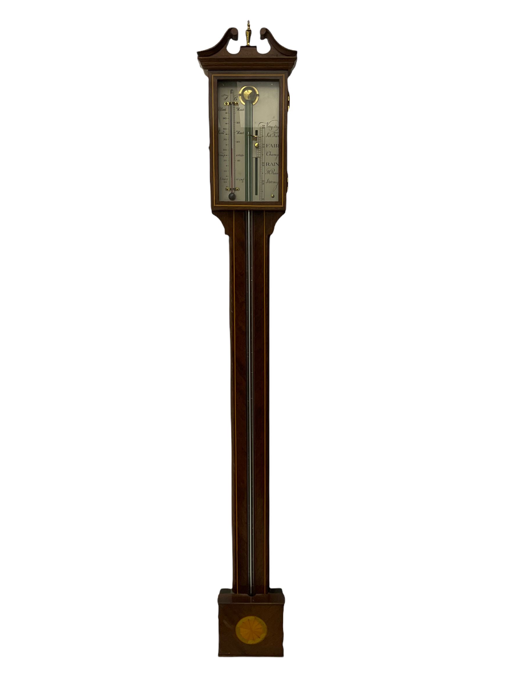 A 20th century mercury stick barometer in an earlier 18th century style,
with a swan’s neck pediment and inlaid square cistern cover, enclosed silvered register with vernier and spirit thermometer, indicating barometric air pressure from 27 to 31 inches, with weather predictions and room temperature measured in both degrees Celsius and Fahrenheit. H70cm


