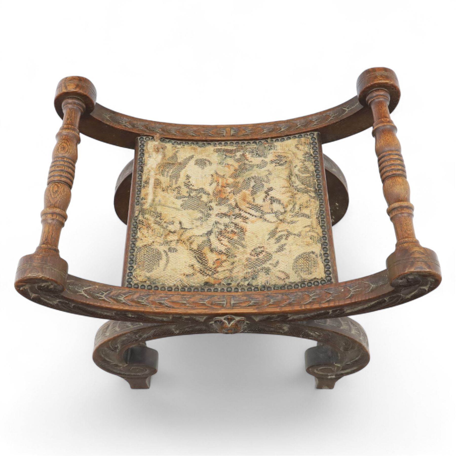 Late 19th century carved oak X-frame stool with tapestry seat