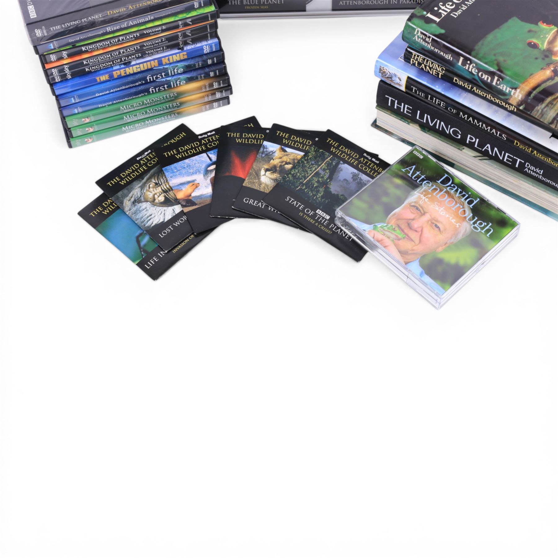 David Attenborough memorabilia, including framed montage of a Sunday Times Magazine cover and two DVD sleeves, one signed, books including first editions, DVDs and Audio CDs