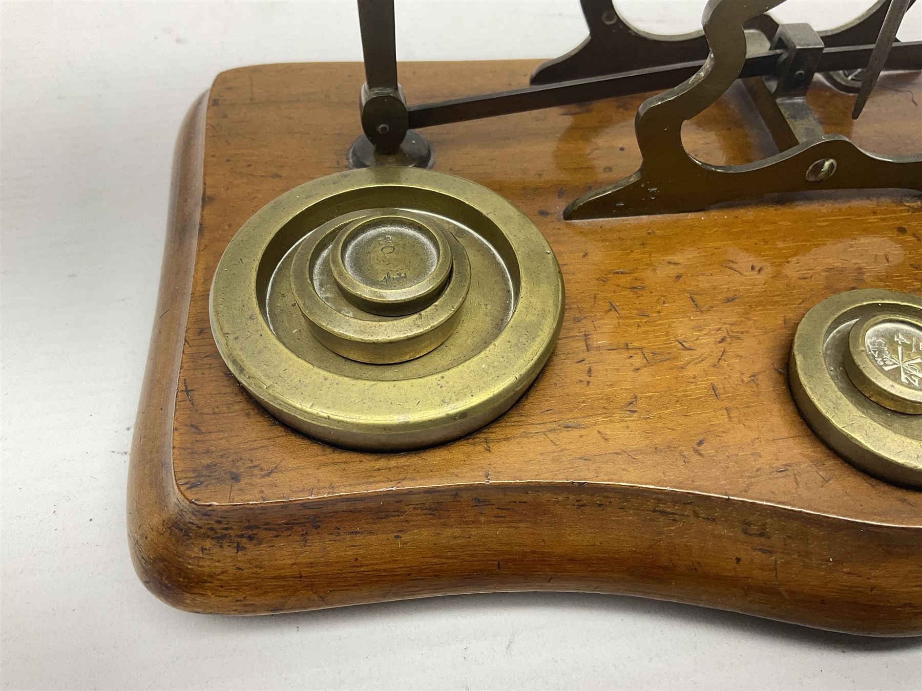 Set of brass postal scales, on wooden base