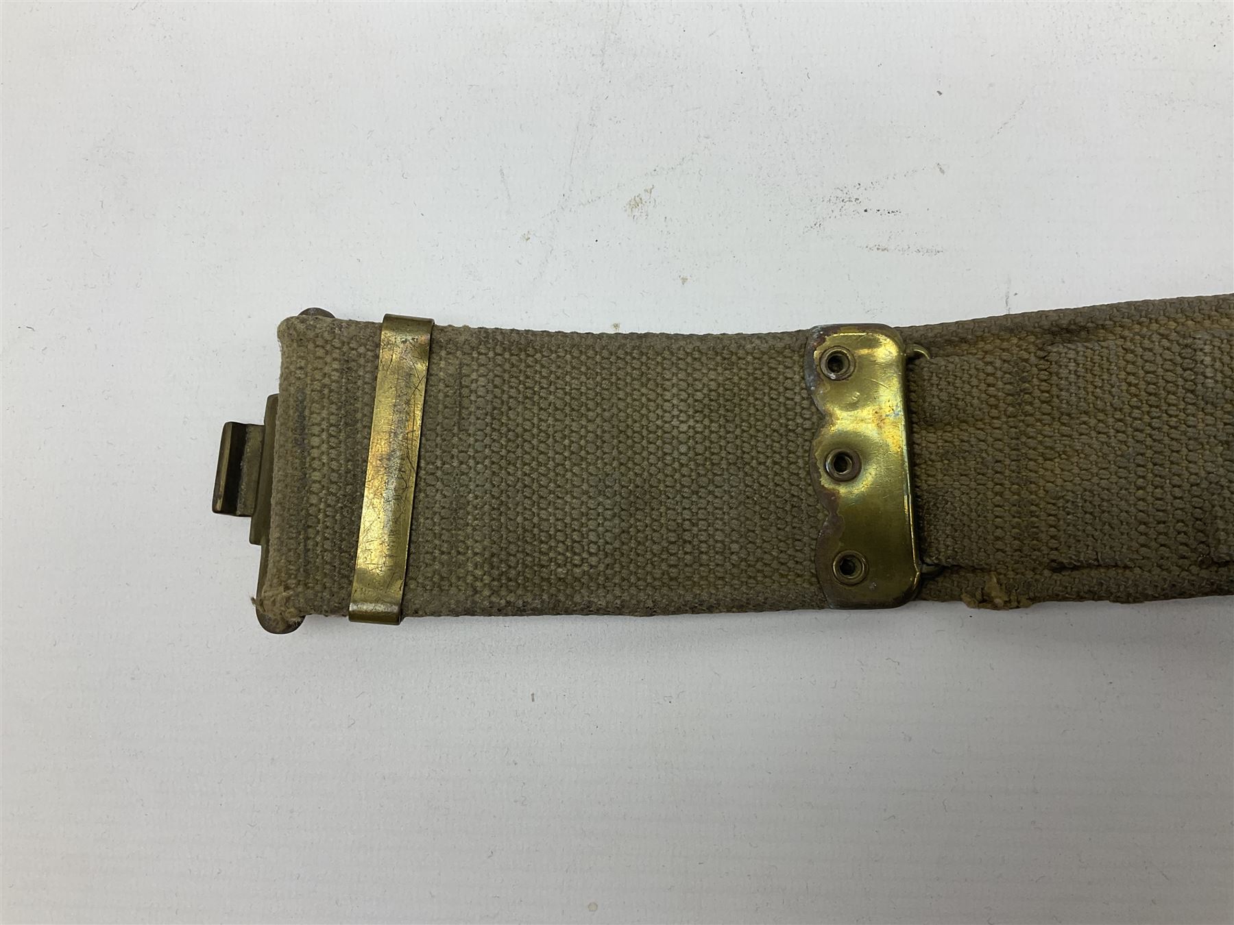 WW2 British black felt beret with Pioneer Corps cap badge, with Kangol Wear maker's mark dated 1943; and a British Army green webbing belt (2)